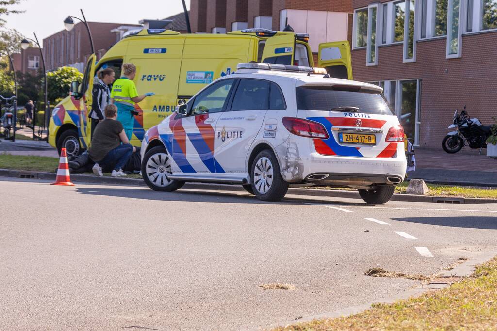 Gewonde na val met motor op rotonde