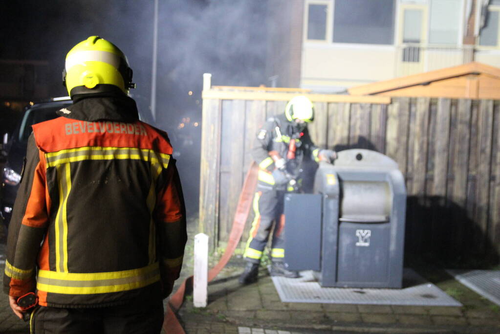 Ondergrondse container in brand