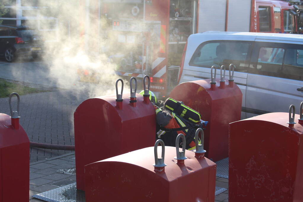 Brand in ondergrondse papiercontainer