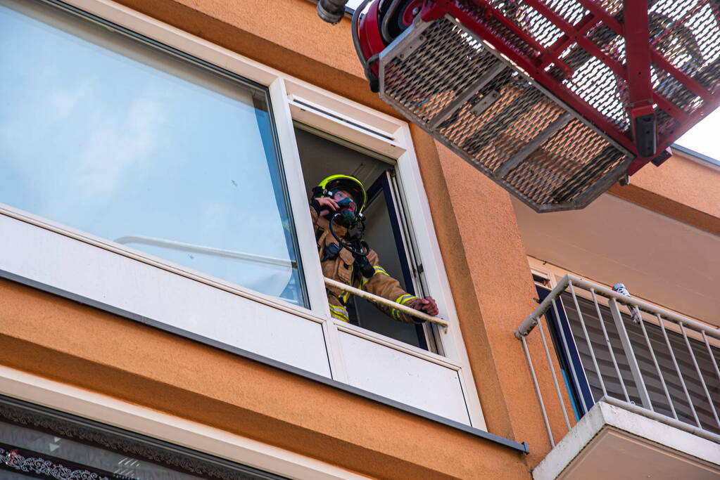 Brand in slaapkamer van portiekwoning