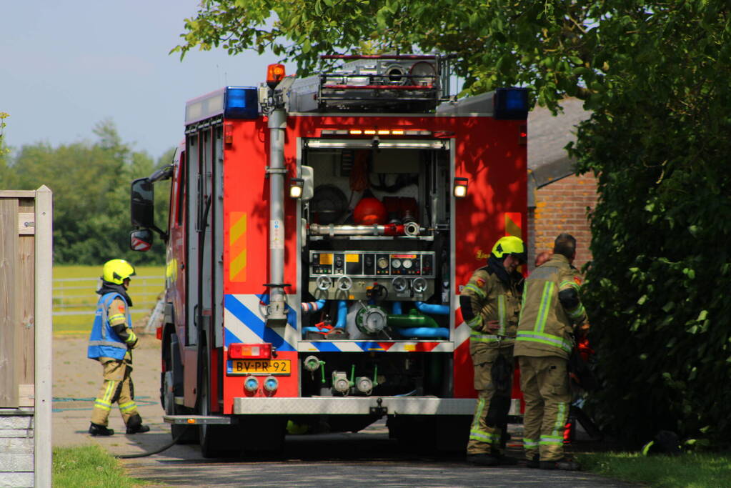 Brand in muur van schuur