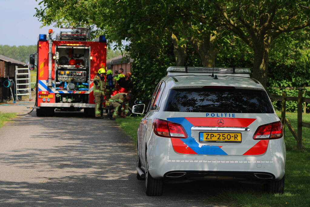 Brand in muur van schuur