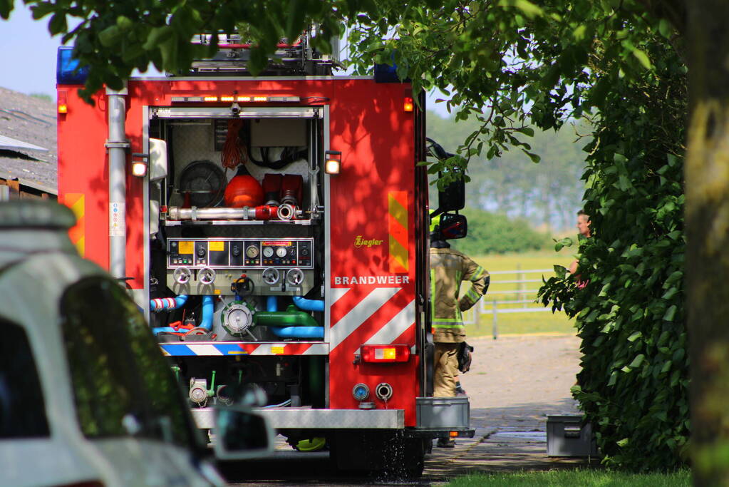 Brand in muur van schuur