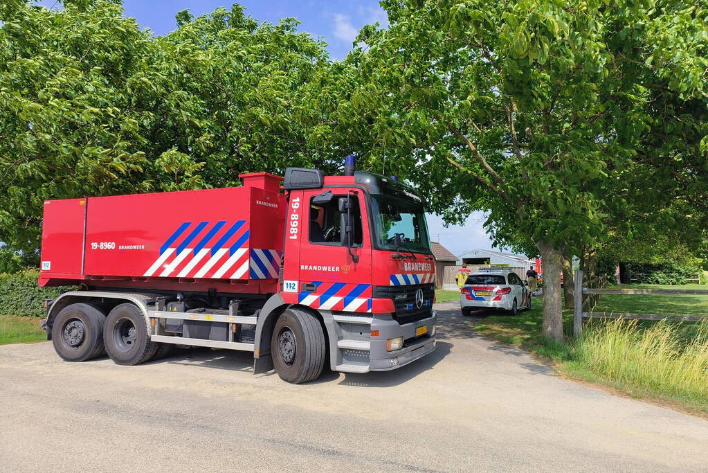 Brand in muur van schuur