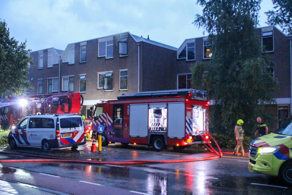 Brand in woning, persoon aangehouden