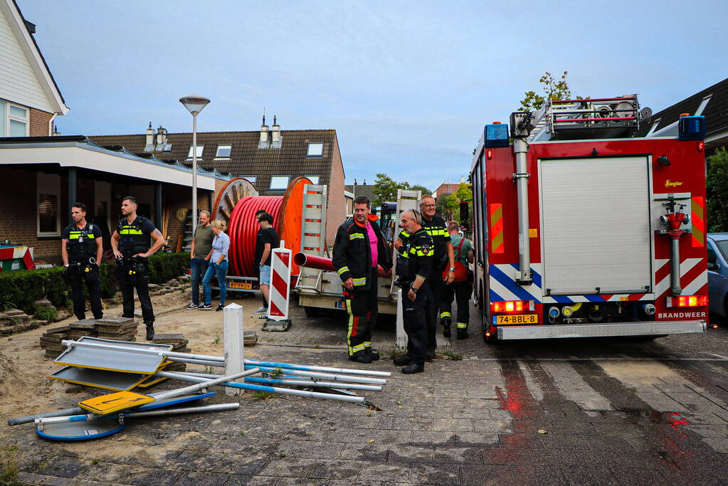 Straat onder water door leidingbreuk