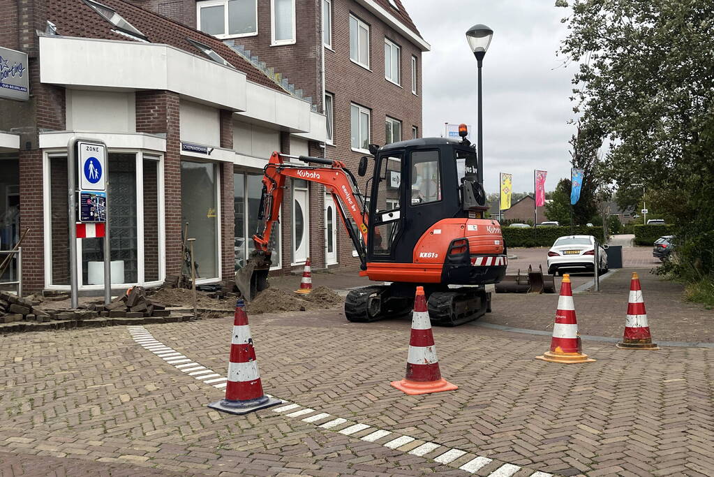 Schade aan weg door waterlekkage