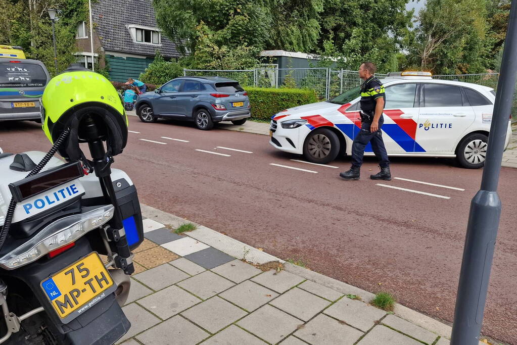 Scooterrijder en fietser in botsing