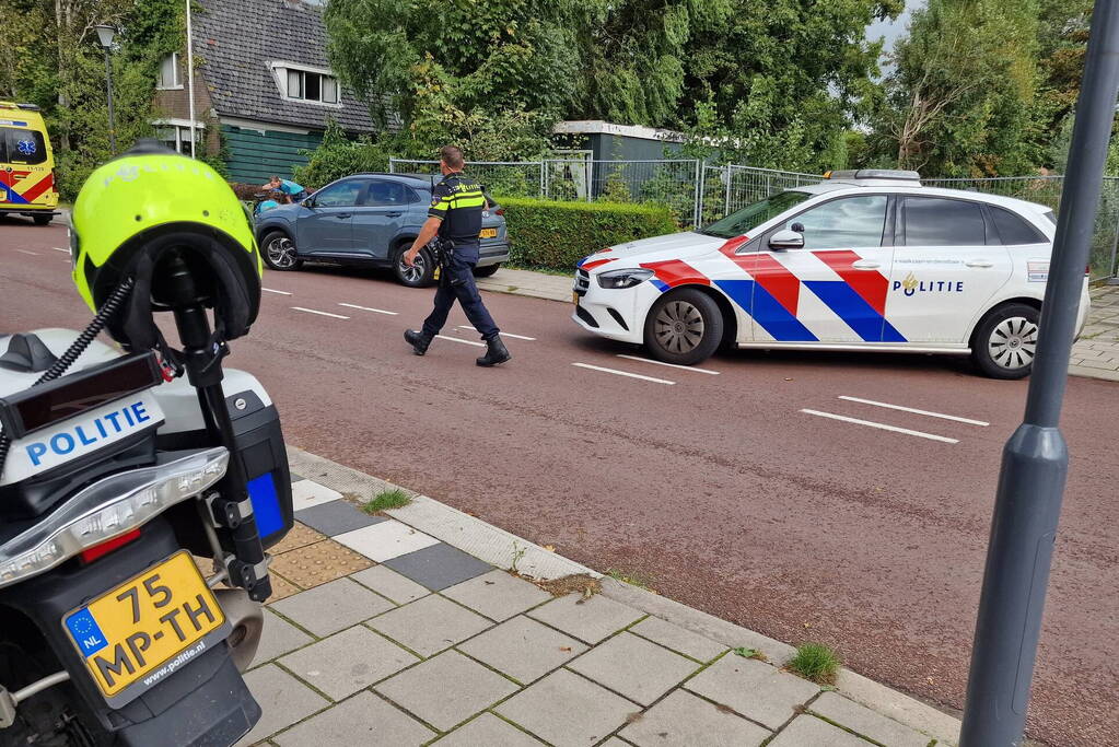 Scooterrijder en fietser in botsing