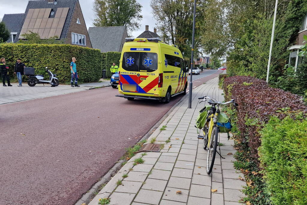 Scooterrijder en fietser in botsing