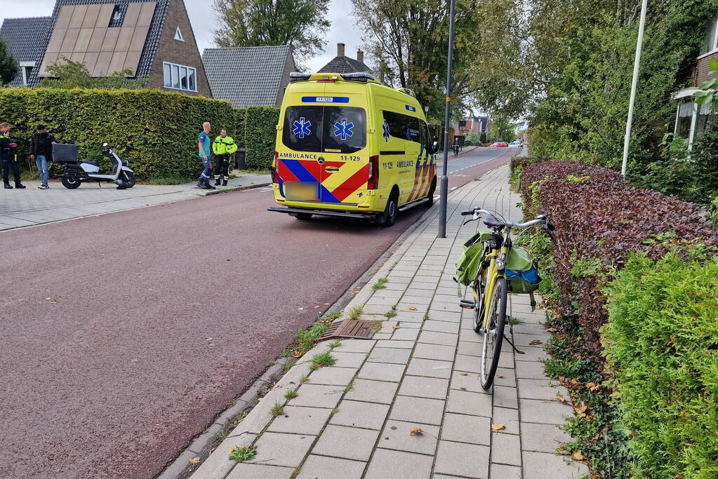 Scooterrijder en fietser in botsing