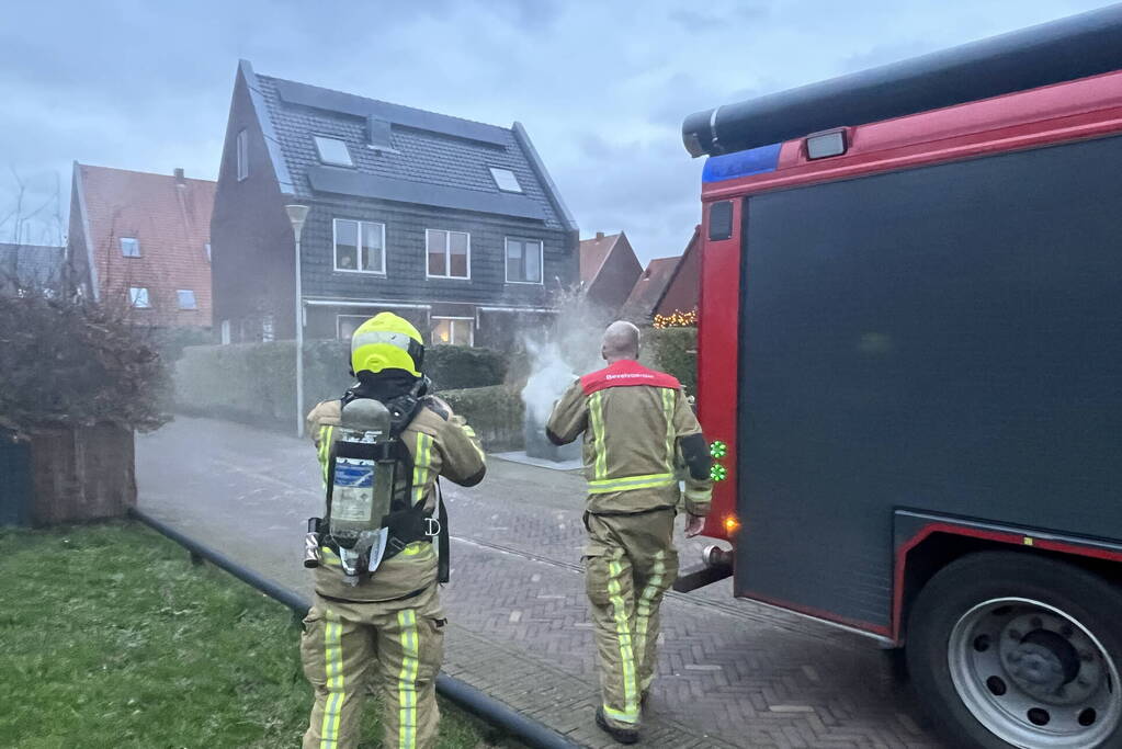 Ondergrondse container in brand