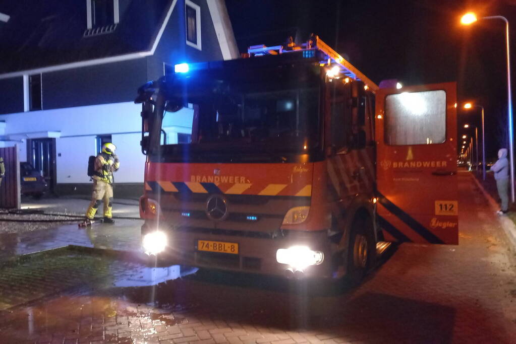 Afvalbrand bij woning