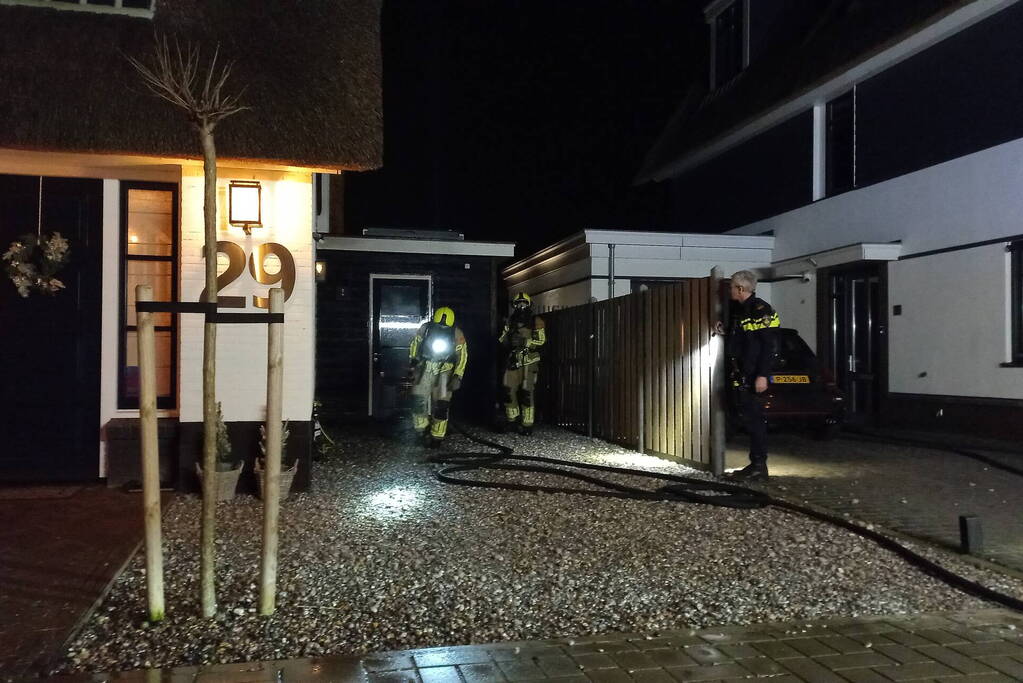 Afvalbrand bij woning