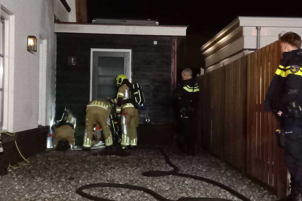 Afvalbrand bij woning