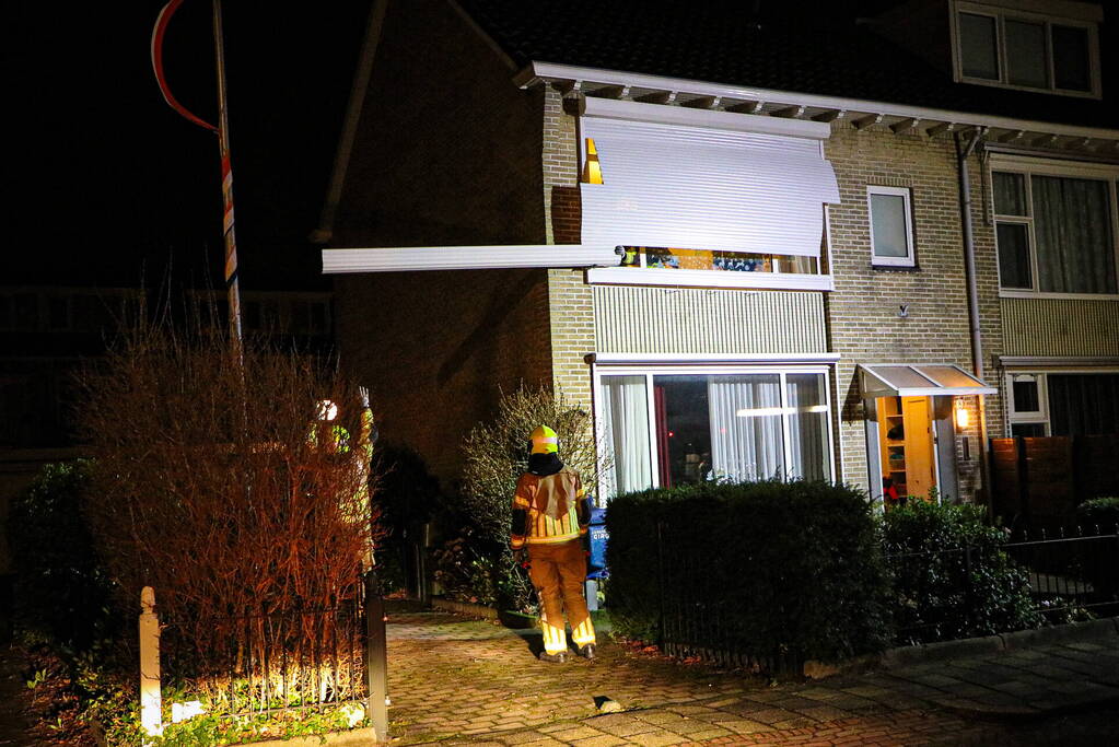 Rolluik van woning los door storm