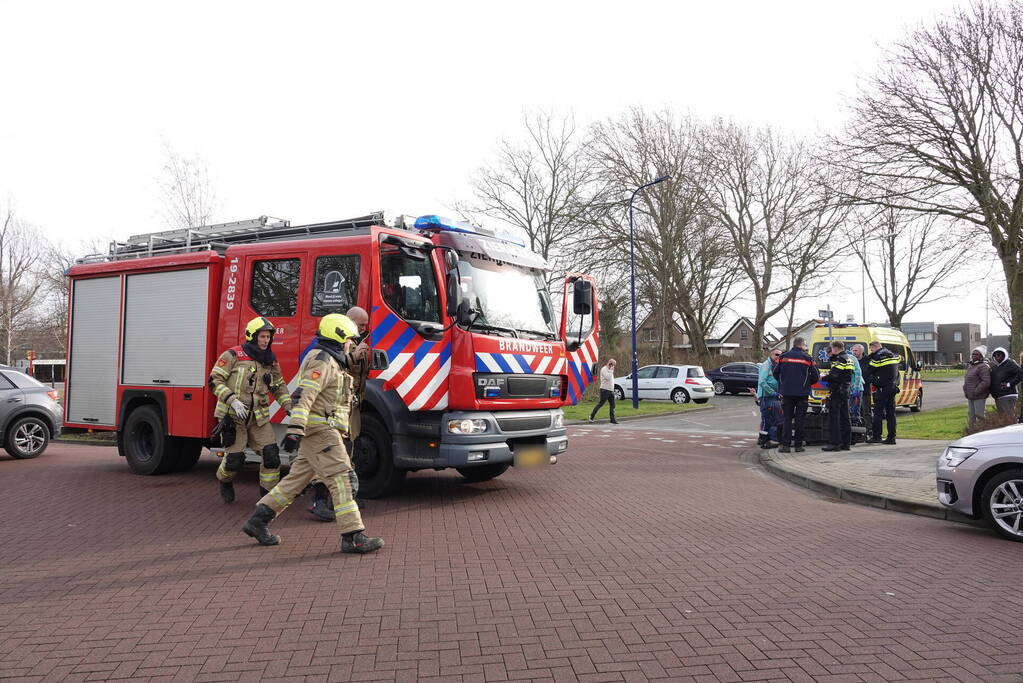 Vrouw bekneld onder scootmobiel