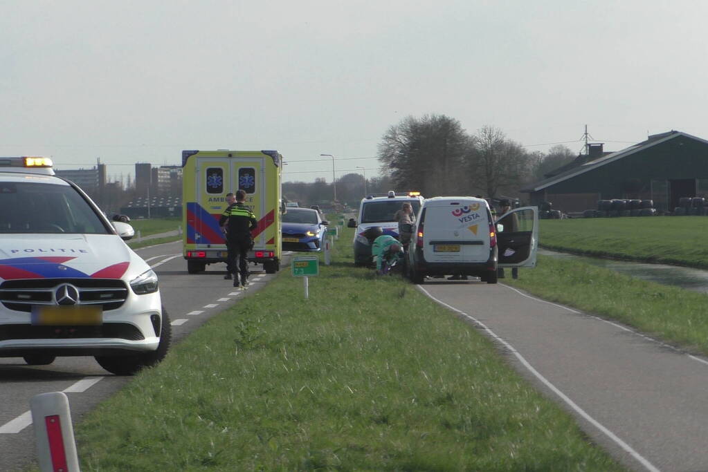 Scooterrijder en fietser in botsing