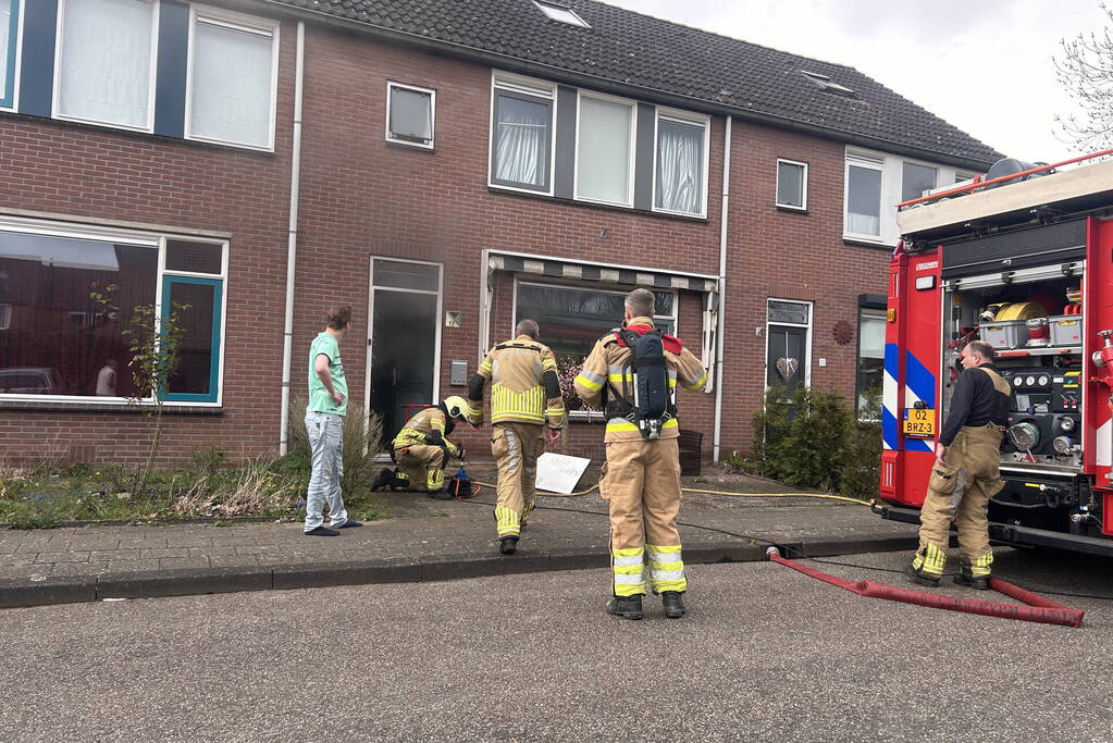 Rookontwikkeling bij brand in keuken van woning