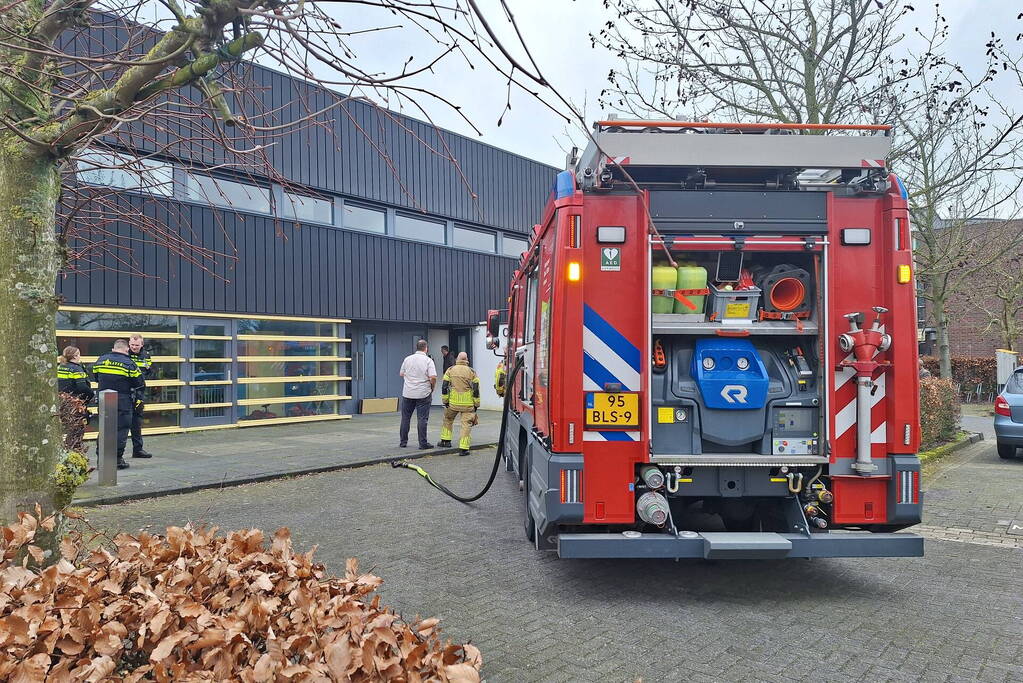 Rookontwikkeling in kerk door TL-balk