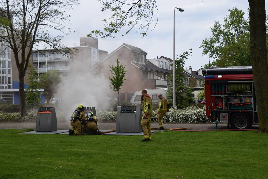 Fikse rookontwikkeling bij brand in textiel container