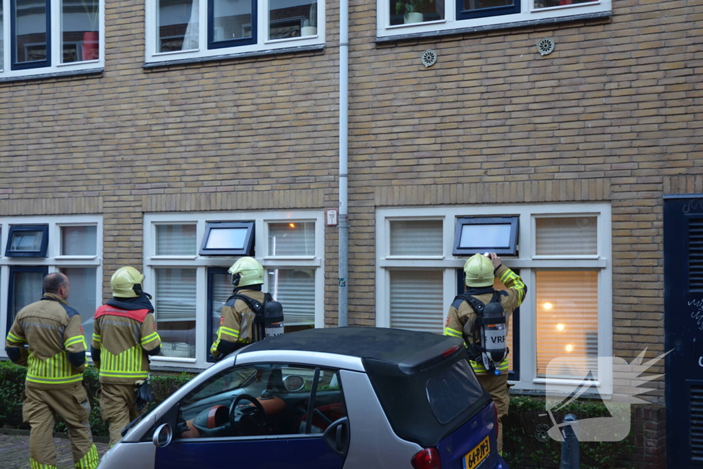 Appartement vol rook door keukenbrand