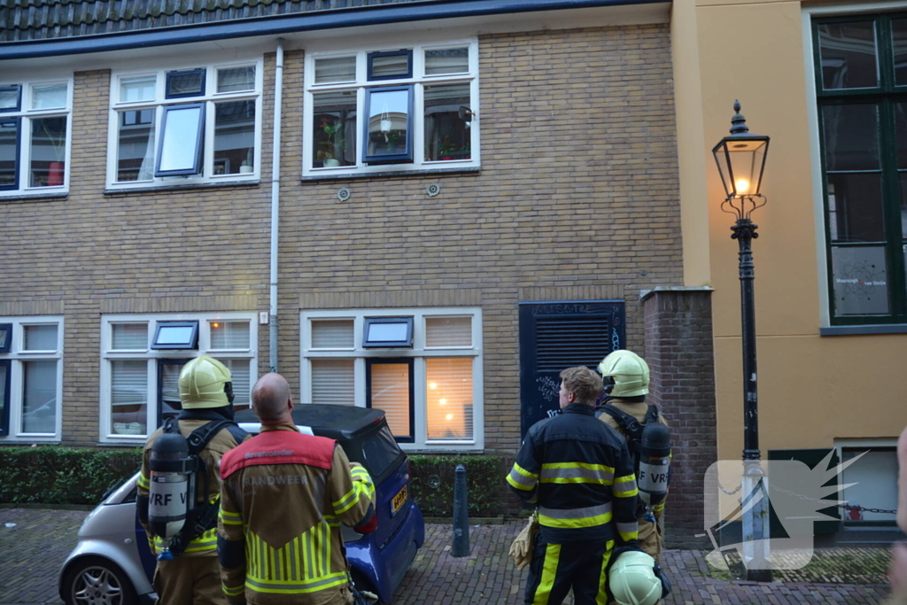 Appartement vol rook door keukenbrand