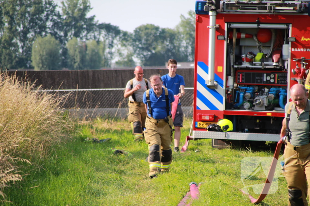 Middelbrand na bermbrand langs spoor