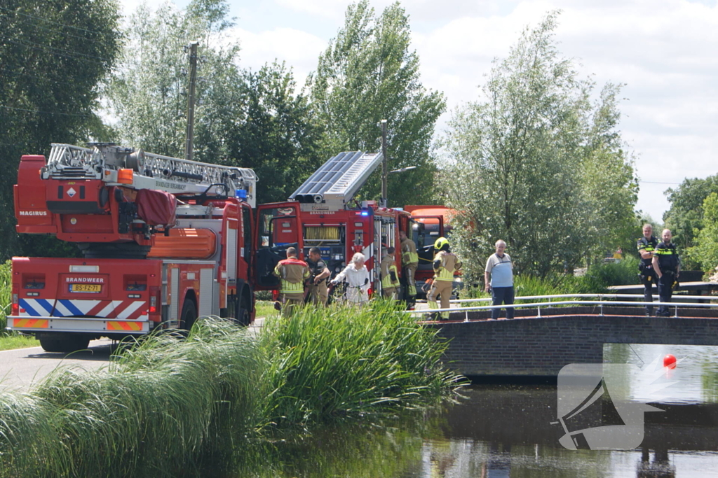 Container in brand tegen woning