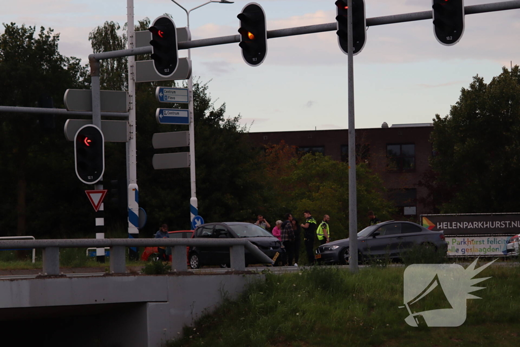 Schade na botsing op kruising