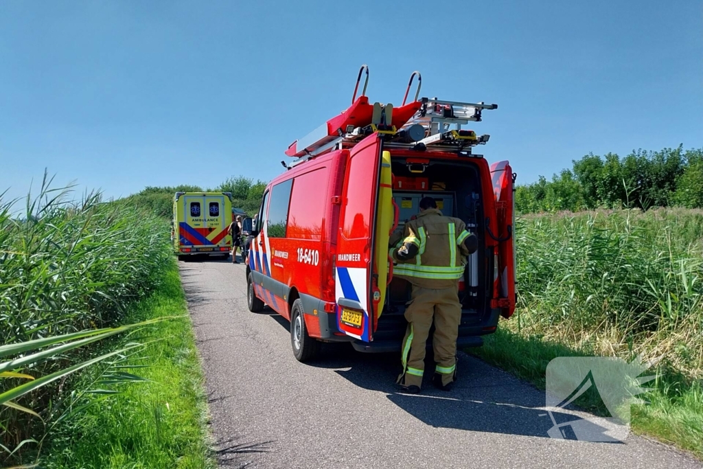 Persoon op scootmobiel belandt in water