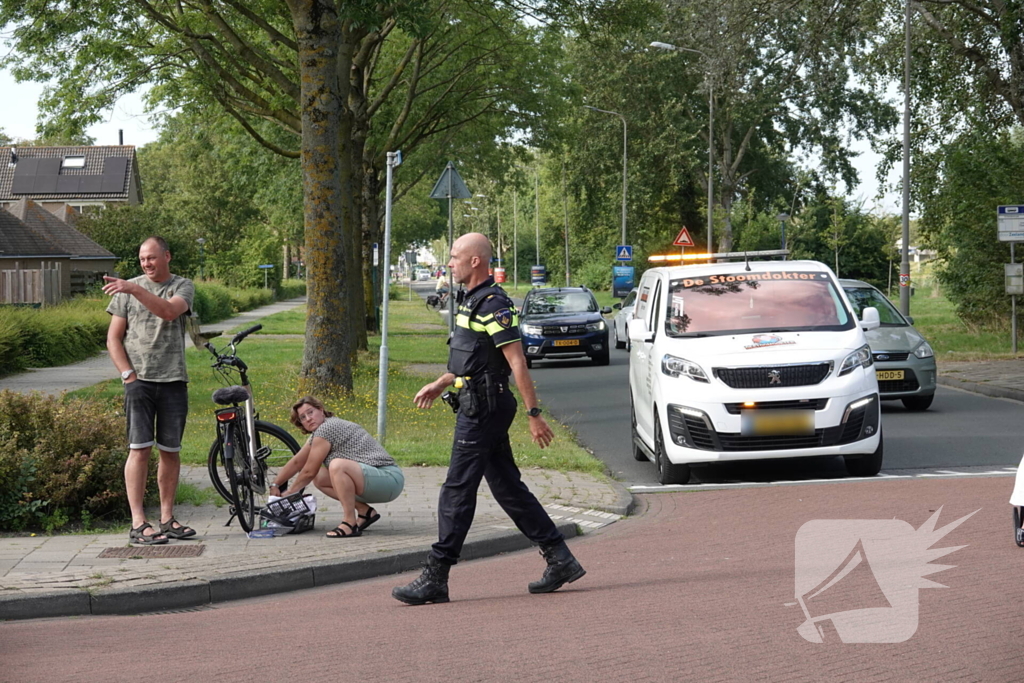 Automobilist schept fietser