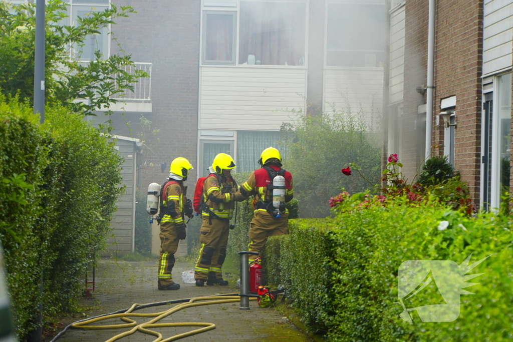 Uitslaande woningbrand door wasmachine