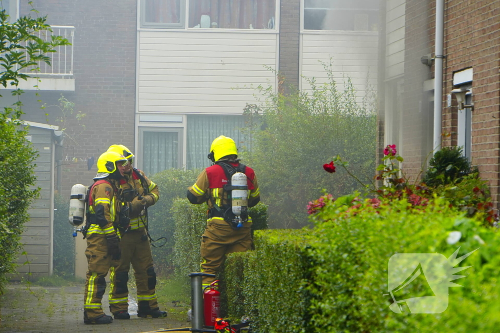 Uitslaande woningbrand door wasmachine