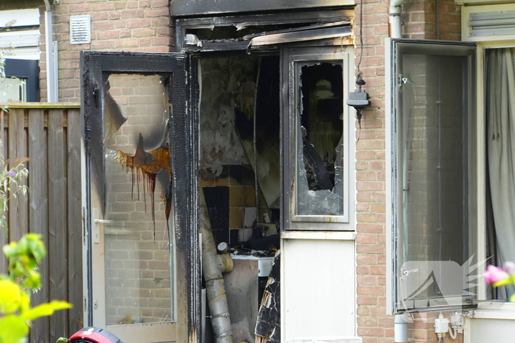 Uitslaande woningbrand door wasmachine