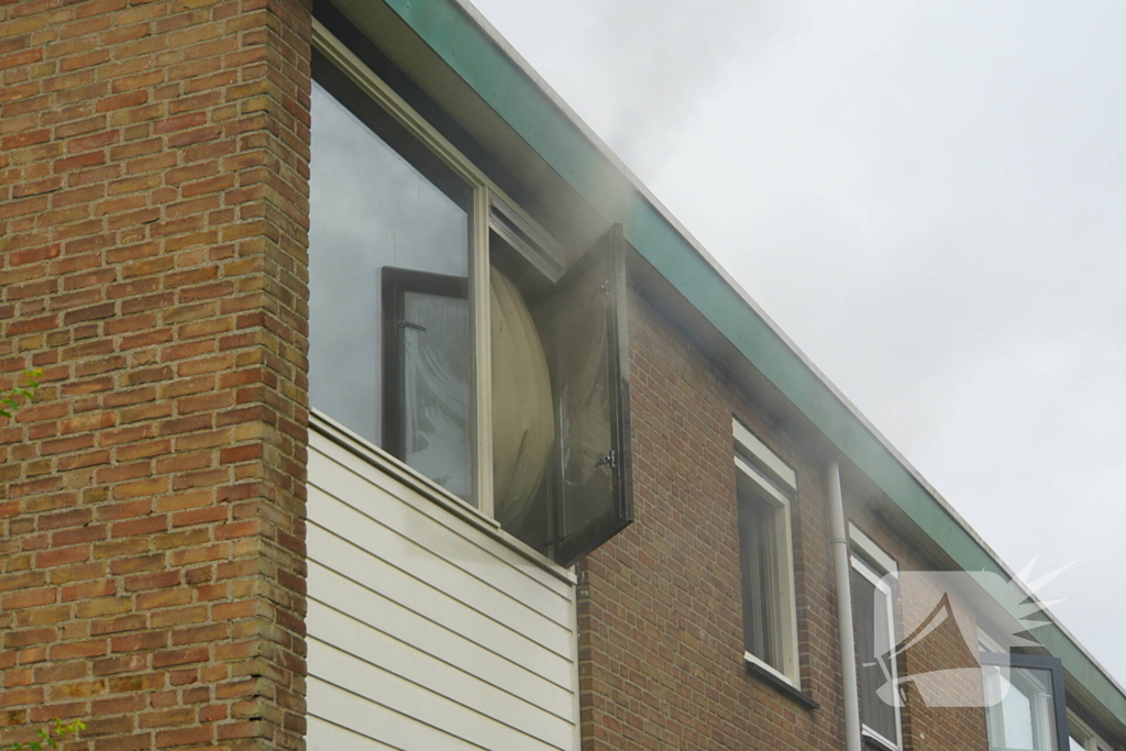 Uitslaande woningbrand door wasmachine