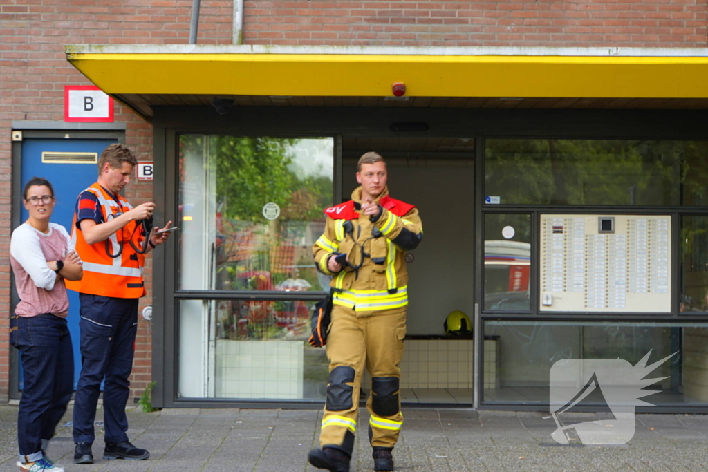 Rookontwikkeling op vijfde verdieping door keukenbrand