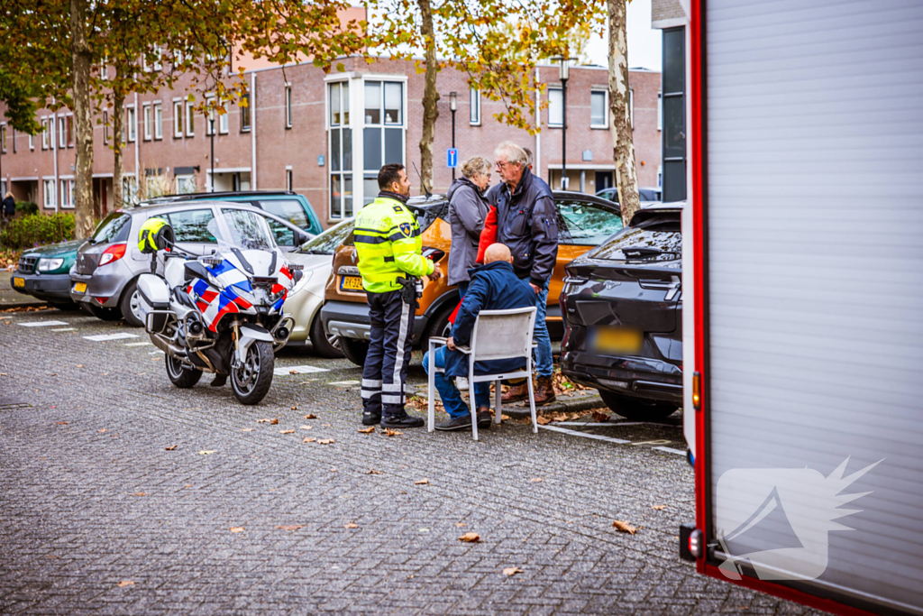 Persoon bekneld in auto