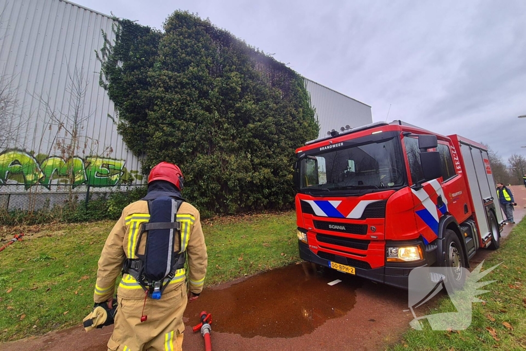 Begroeiing tegen pand in brand