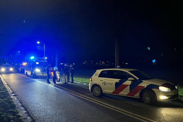 Twee personen ten val met motor