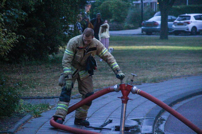 Brand in woning, persoon aangehouden