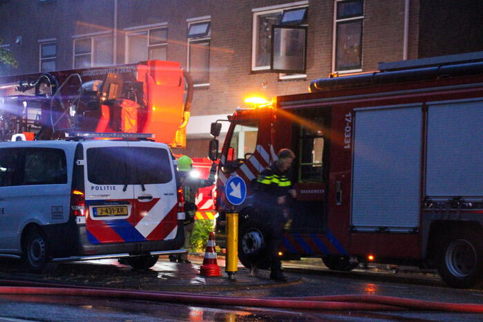 Brand in woning, persoon aangehouden