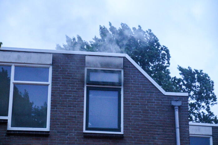 Brand in woning, persoon aangehouden