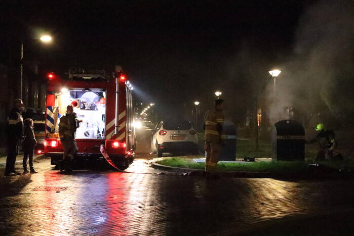 Ondergrondse container in brand gestoken