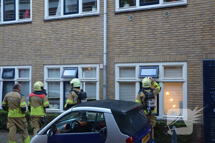 Appartement vol rook door keukenbrand