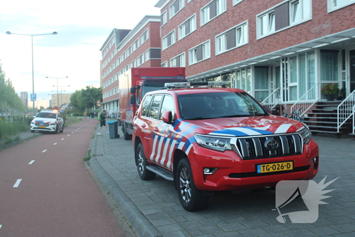 Flatgebouw ontruimd door brand in woning