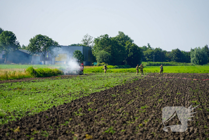 Grote rookwolken door brand in tractor