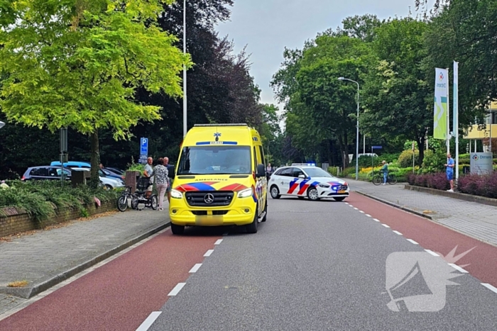 Persoon op driewieler ten val