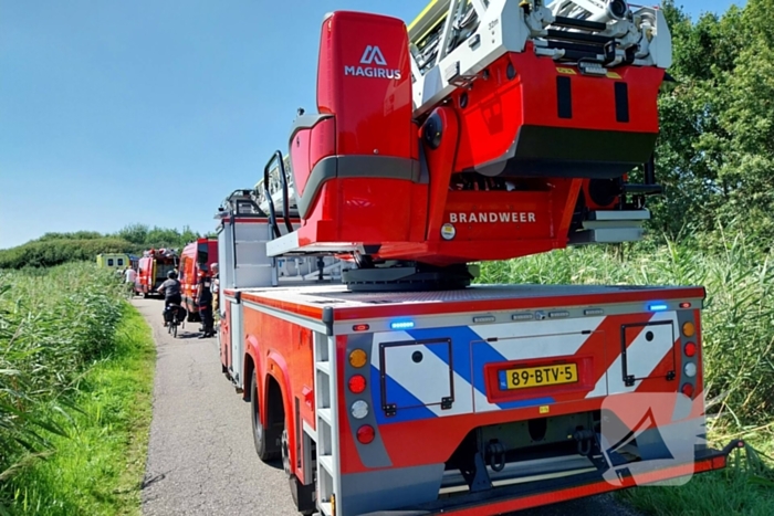 Persoon op scootmobiel belandt in water