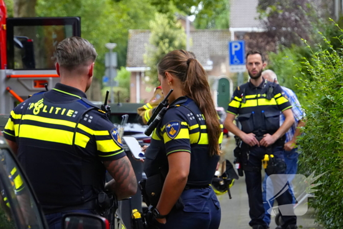 Persoon ademt rook in bij keukenbrand